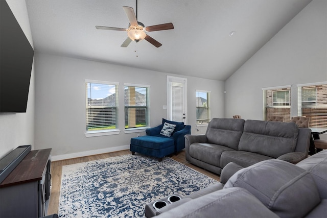 17828 Hanson Ridge Dr, Conroe, TX 77316 - living room with a ceiling fan, wood finished floors, baseboards, and high vaulted ceiling