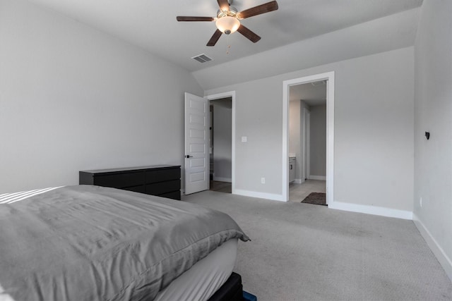 17828 Hanson Ridge Dr, Conroe, TX 77316 - bedroom featuring light carpet, vaulted ceiling, baseboards, a ceiling fan, and ensuite bathroom