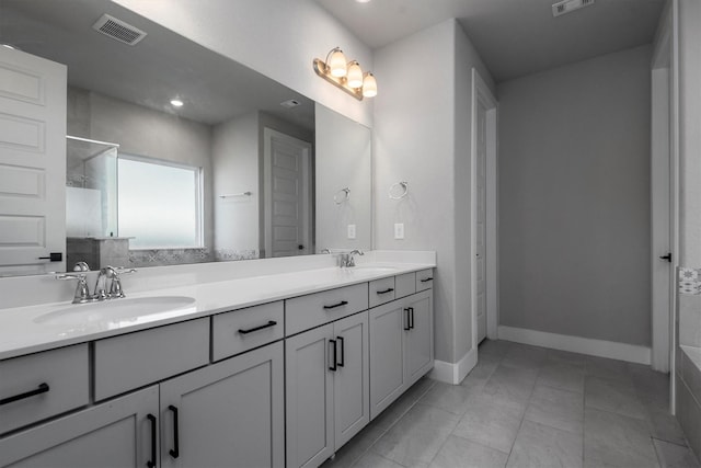 17828 Hanson Ridge Dr, Conroe, TX 77316 - bathroom with tiled shower, double vanity, and baseboards
