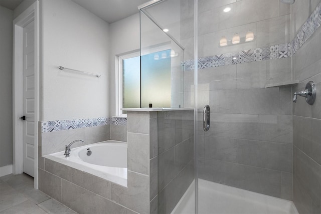 17828 Hanson Ridge Dr, Conroe, TX 77316 - bathroom with a garden tub, a shower stall, and tile patterned flooring