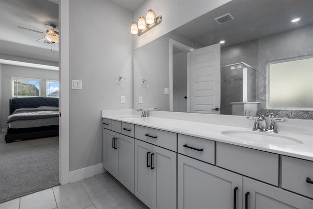 17828 Hanson Ridge Dr, Conroe, TX 77316 - full bath with ceiling fan, a stall shower, double vanity, baseboards, and ensuite bathroom