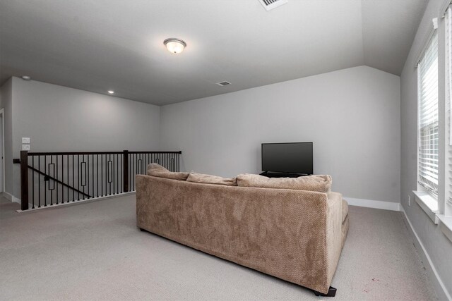 17828 Hanson Ridge Dr, Conroe, TX 77316 - carpeted living room with lofted ceiling and baseboards