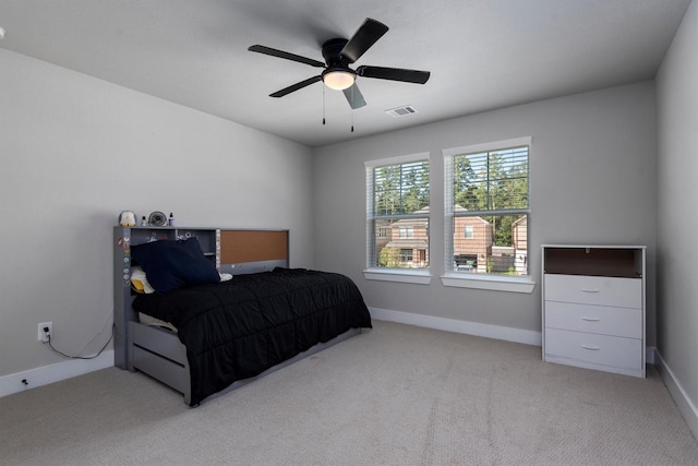 17828 Hanson Ridge Dr, Conroe, TX 77316 - bedroom with light colored carpet, baseboards, and a ceiling fan