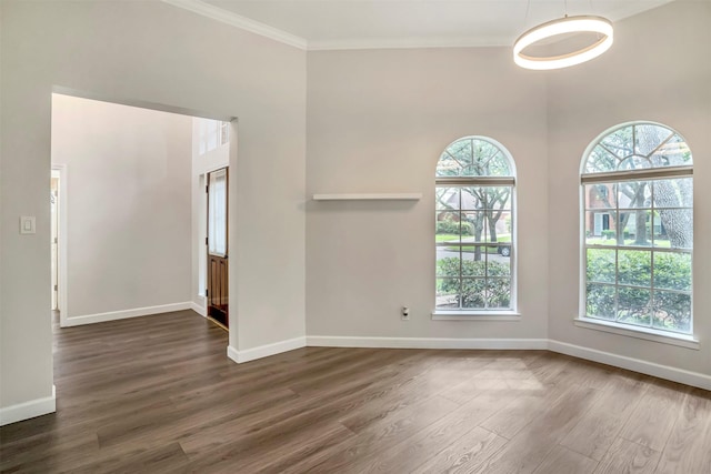 17422 Marigold Dr, Sugar Land, TX 77479 - spare room with dark wood-style floors, baseboards, and crown molding
