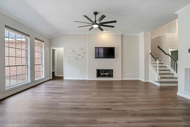 17422 Marigold Dr, Sugar Land, TX 77479 - unfurnished living room featuring ceiling fan, stairs, crown molding, wood finished floors, and baseboards