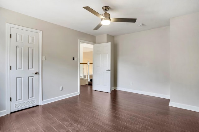17422 Marigold Dr, Sugar Land, TX 77479 - unfurnished bedroom with dark wood-style floors, baseboards, and ceiling fan