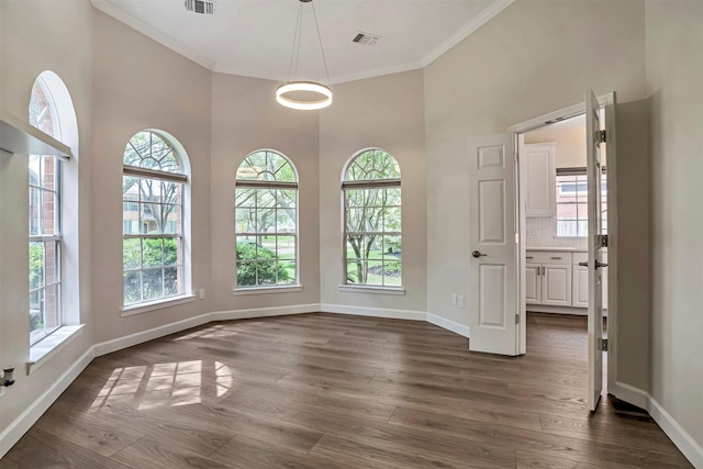 17422 Marigold Dr, Sugar Land, TX 77479 - unfurnished dining area with ornamental molding, baseboards, dark wood-style floors, and a high ceiling