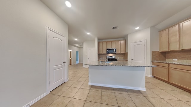 kitchen with light brown cabinets, recessed lighting, light tile patterned floors, stainless steel appliances, and tasteful backsplash