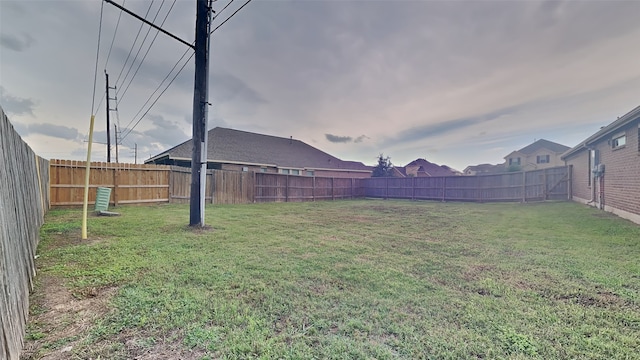 view of yard with a fenced backyard