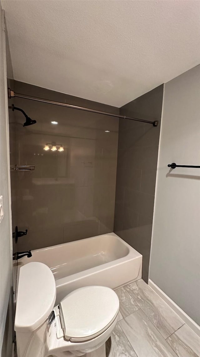 407 Bendwood Dr Unit 38, Houston, TX 77024 - full bath featuring toilet,  shower combination, baseboards, and a textured ceiling