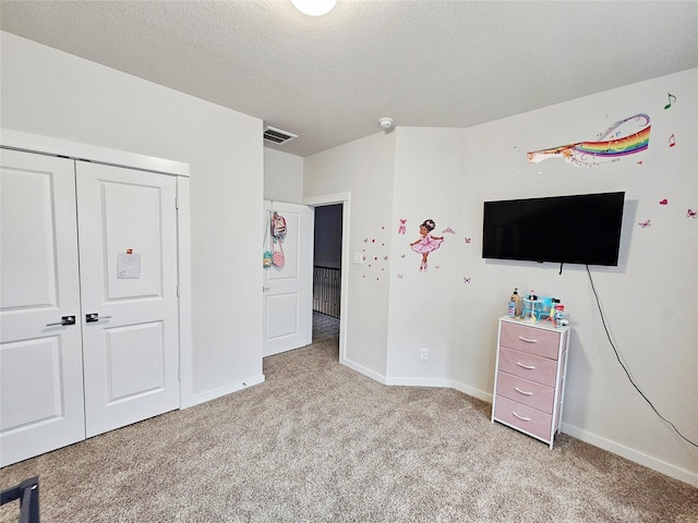 bedroom with baseboards, visible vents, and light colored carpet