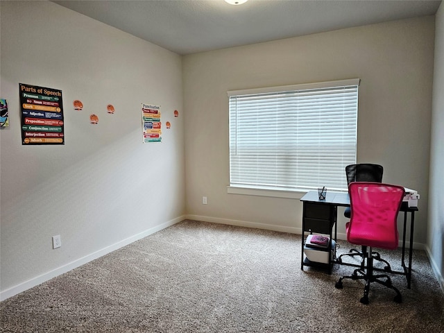 carpeted home office featuring baseboards