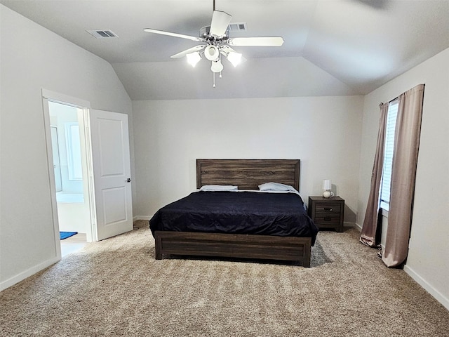 carpeted bedroom with connected bathroom, visible vents, baseboards, ceiling fan, and lofted ceiling