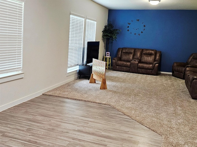 living room with wood finished floors and baseboards