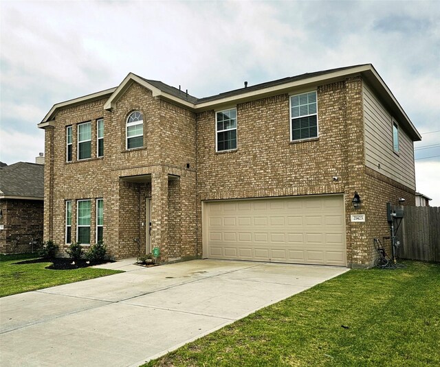 traditional-style home featuring concrete driveway, brick siding, a garage, and a front lawn