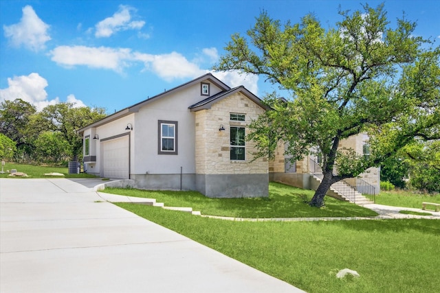 3419 Campestres, Spring Branch, TX 78070 - view of home's exterior featuring an attached garage, a yard, driveway, and stone siding