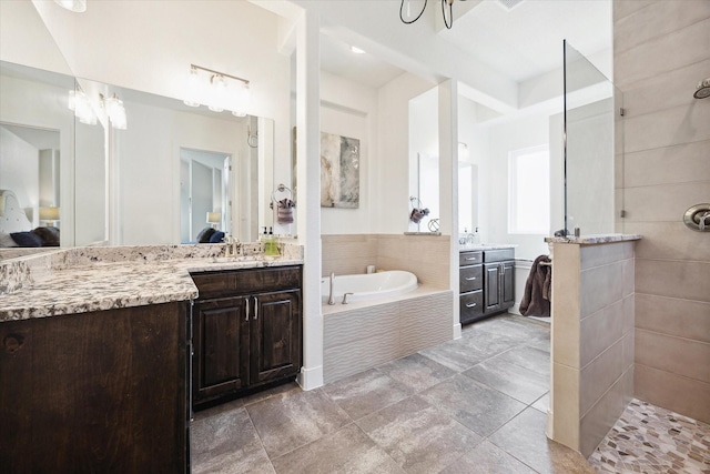 3419 Campestres, Spring Branch, TX 78070 - ensuite bathroom with a sink, walk in shower, a notable chandelier, two vanities, and a garden tub
