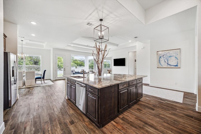 3419 Campestres, Spring Branch, TX 78070 - kitchen with stainless steel appliances, dark wood-type flooring, a chandelier, dark brown cabinetry, and a tray ceiling