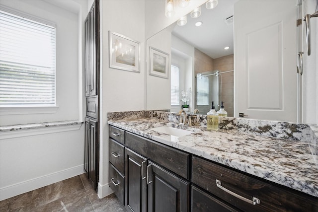 3419 Campestres, Spring Branch, TX 78070 - bathroom with vanity, a wealth of natural light, baseboards, and a shower stall