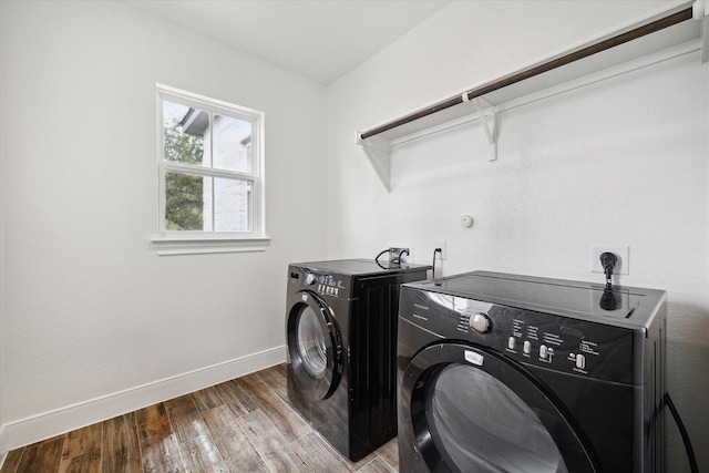 3419 Campestres, Spring Branch, TX 78070 - clothes washing area with washing machine and dryer, laundry area, baseboards, and wood finished floors