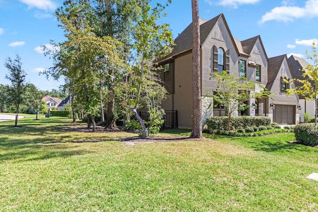 203 S Empress Green Pl, Montgomery, TX 77316 - view of side of home with a lawn