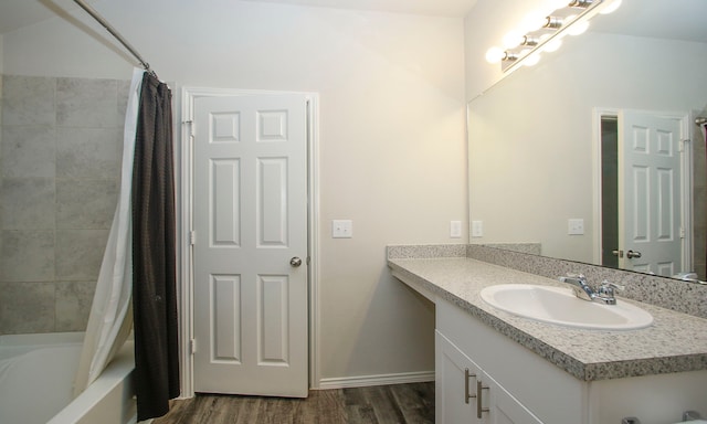 18715 Callalily Bloom Ct, Tomball, TX 77377 - full bathroom featuring baseboards, shower / tub combo, wood finished floors, and vanity