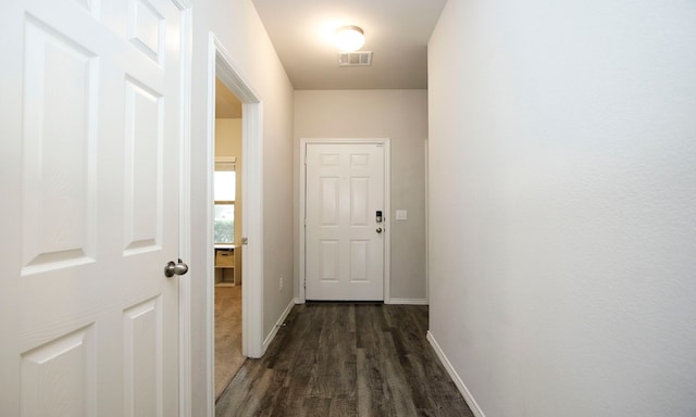 18715 Callalily Bloom Ct, Tomball, TX 77377 - corridor with dark wood finished floors, visible vents, and baseboards