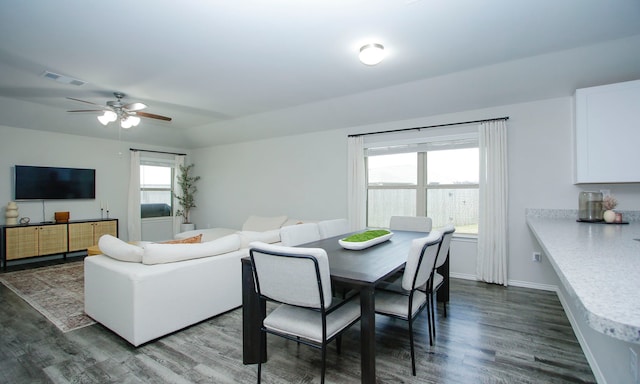 18715 Callalily Bloom Ct, Tomball, TX 77377 - dining space featuring dark wood-style flooring, baseboards, a ceiling fan, and visible vents