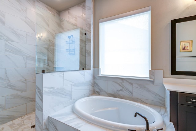 9823 Starry Night Ln, Manvel, TX 77578 - full bathroom featuring a walk in shower, a bath, and vanity