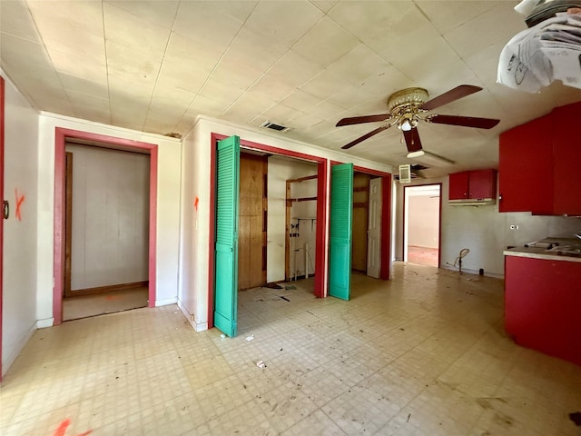 interior space featuring a ceiling fan and light floors