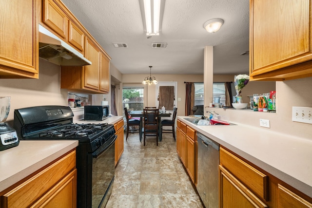 7210 Avocet Ln, Houston, TX 77040 - kitchen with under cabinet range hood, light countertops, visible vents, and black appliances