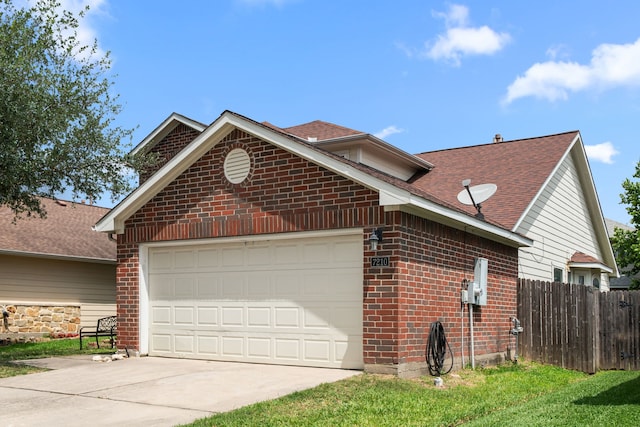 7210 Avocet Ln, Houston, TX 77040 - view of front of home with an attached garage, brick siding, driveway, and fence