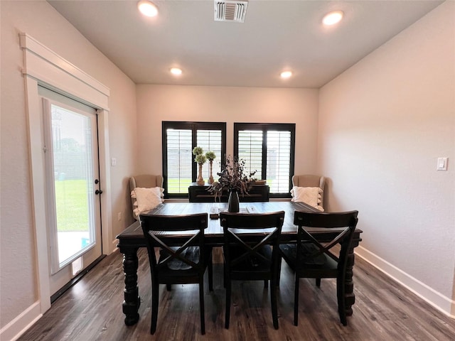 dining area with a healthy amount of sunlight, baseboards, and visible vents