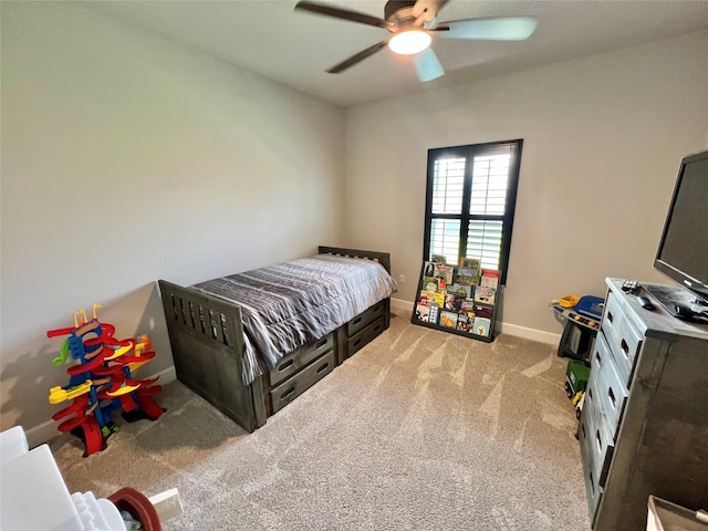 bedroom with carpet, baseboards, and a ceiling fan