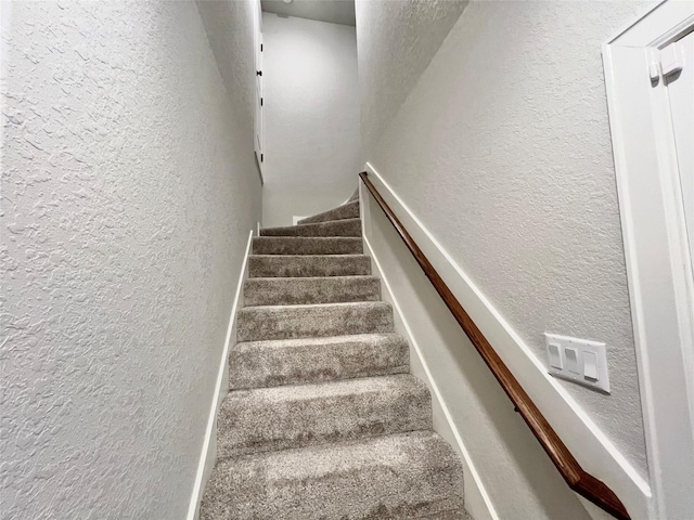stairway with a textured wall