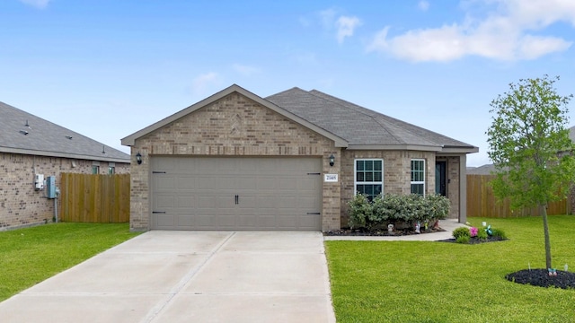 ranch-style house with an attached garage, fence, a front lawn, brick siding, and driveway