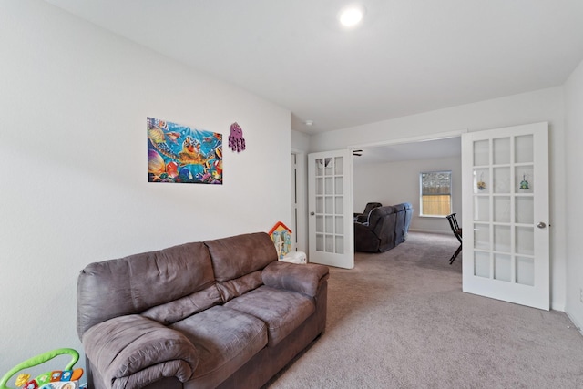 carpeted living room featuring french doors
