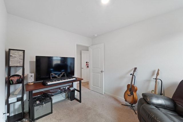 carpeted office space featuring baseboards