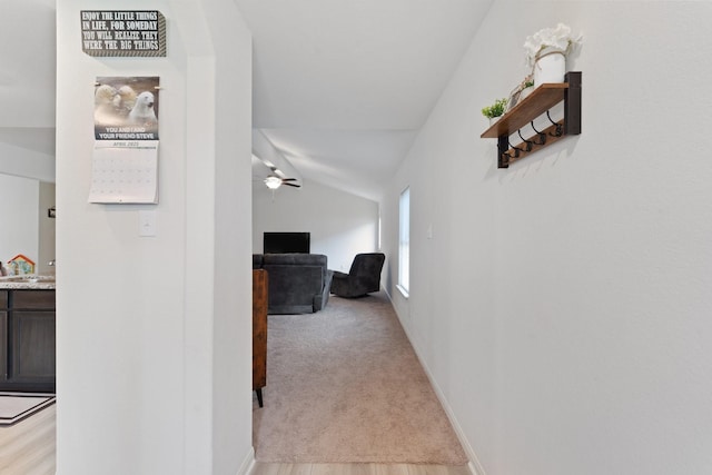 corridor with vaulted ceiling