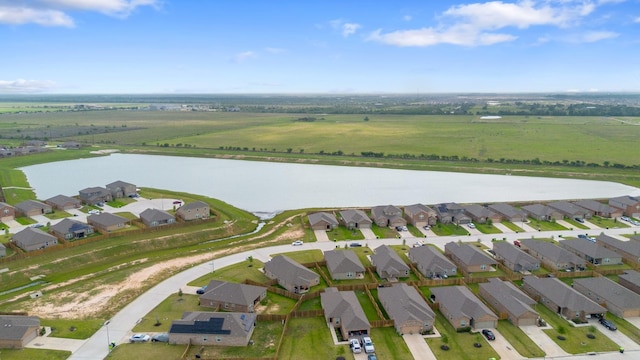 bird's eye view featuring a water view and a residential view