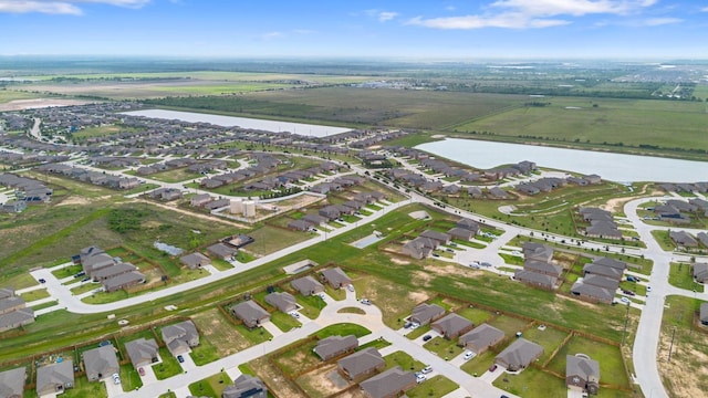 bird's eye view with a water view and a residential view