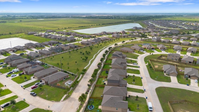 birds eye view of property with a water view and a residential view
