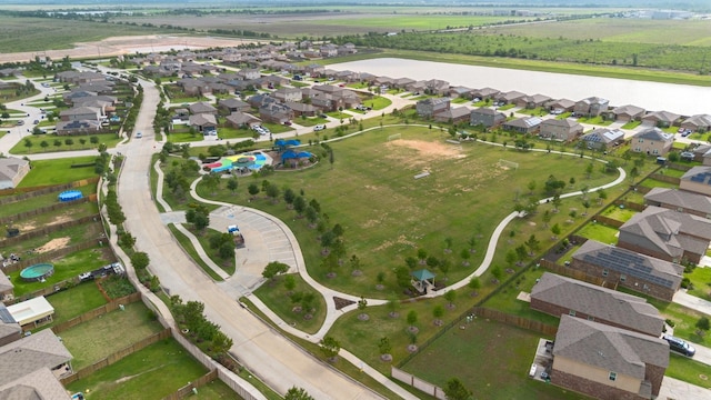 drone / aerial view featuring a water view and a residential view
