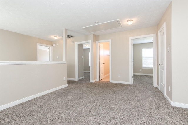 24006 Lestergate Dr, Spring, TX 77373 - unfurnished room with attic access, baseboards, carpet flooring, and visible vents