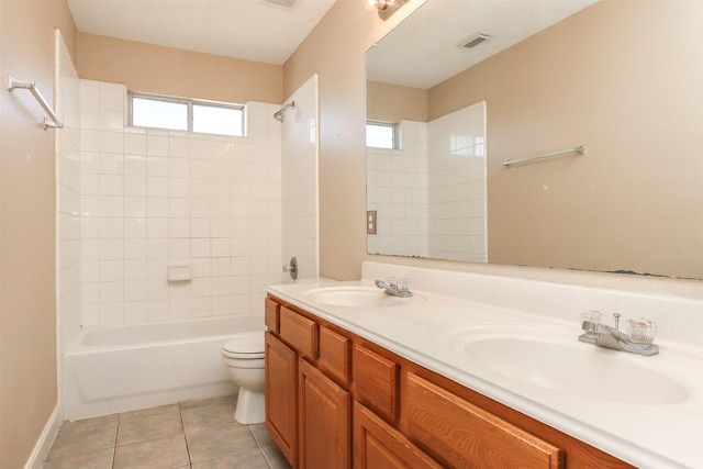24006 Lestergate Dr, Spring, TX 77373 - bathroom featuring toilet, visible vents, a sink, and tub / shower combination