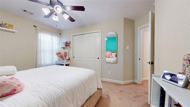 18818 Bene Vista Dr, Houston, TX 77084 - bedroom with a ceiling fan, a closet, visible vents, baseboards, and light colored carpet