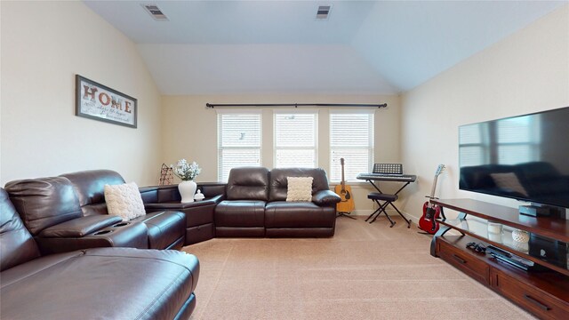 18818 Bene Vista Dr, Houston, TX 77084 - living room featuring visible vents, lofted ceiling, and light carpet