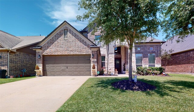 18818 Bene Vista Dr, Houston, TX 77084 - view of front of property with an attached garage, brick siding, driveway, and a front lawn