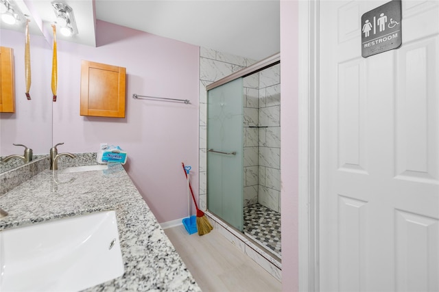 10302 Lybert Rd, Houston, TX 77041 - full bath featuring a sink, double vanity, a stall shower, and baseboards