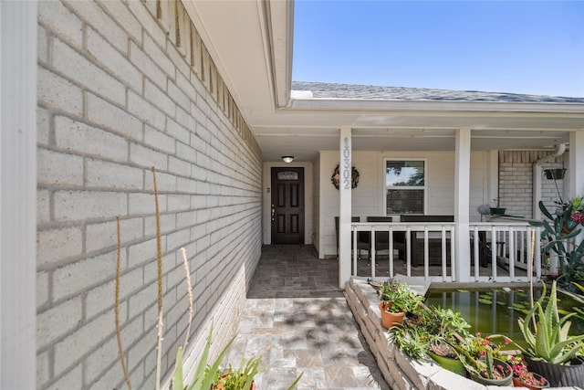 10302 Lybert Rd, Houston, TX 77041 - entrance to property featuring a porch and a shingled roof